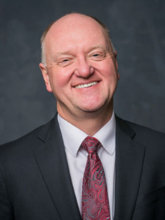 Headshot of Andrew Karolyi